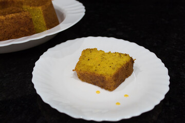 Homemade sweet and tasty cake on dark background