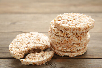 A stack of dietary round, airy, crisp buckwheat crispbread on grey wooden background