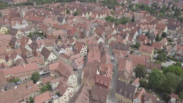 Aerial view of Bamberg old town, Bavaria, Germany. Ancient historic half-timbered buildings medieval houses with orange roofs. Beautiful cityscape. Summer. Wall around the town. Unesco heritage. High