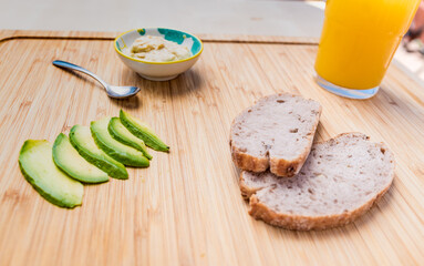 Avocado toast with hummus and black pepper.