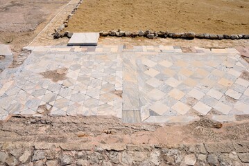 Pieces of floor tiles at the Neolithic period Kourion Ancient city in Cyprus