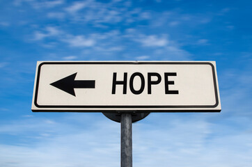 Hope road sign, arrow on blue sky background. One way blank road sign with copy space. Arrow on a...