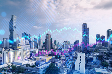 Forex and stock market chart hologram over panorama city view of Bangkok, the financial center in Asia. The concept of international trading. Double exposure.