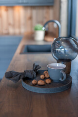 Kitchen counter with a coffee cup and some nuts
