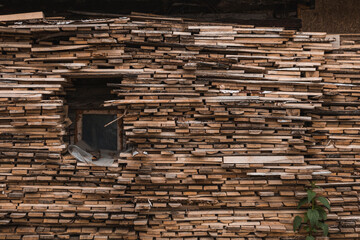 High woodpile, consisting of many stacked rows of firewood