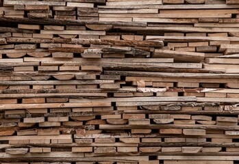 A lot of wooden planks neatly stacked next to each other