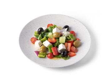 Greek salad on white plate for delivery, vegan food