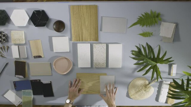 Man architect designer choosing material samples close up.  materials for decoration

