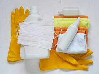 Medical masks, protective gloves, hand sanitizers and detergents on a white background.Do a spring cleaning and protect yourself from the virus.