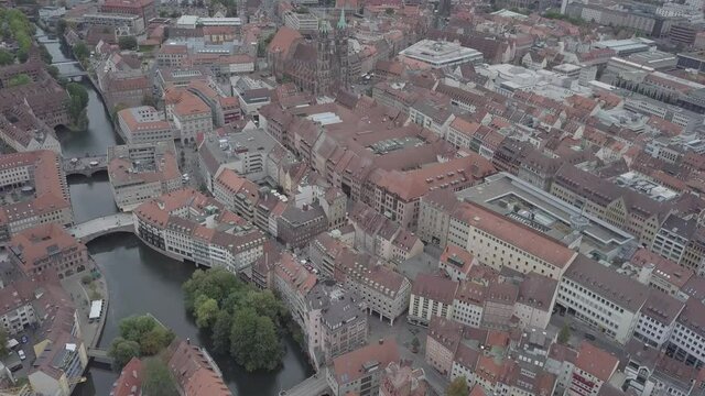 NUREMBERG, GERMANY September 01 2018: Aerial view of Nuremberg old city on Pegnitz river. Medieval church Sankt Sebald ancient architecture, half-timbered buildings, red roofs.