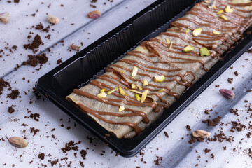 Chocolate crepe With Chocolate Sauce And Pictachios On Top