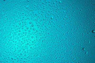 Close-up of water drops on glass . Abstract background texture.