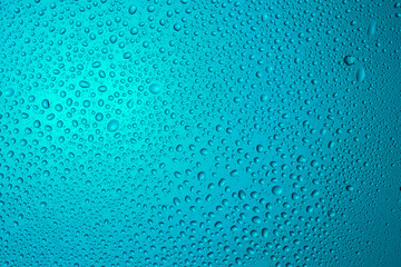 Close-up of water drops on glass . Abstract background texture.