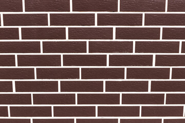 Brown smooth brick wall in a row. Close-up