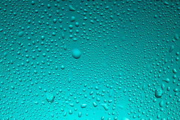 Close-up of water drops on glass . Abstract background texture.