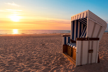 Summer beach at sunset. Empty beach chair on North Sea shore, on Sylt island