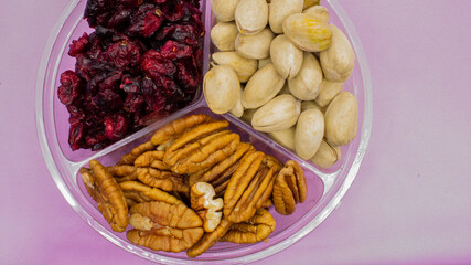 Healthy snacks, nuts, blueberries and pistachios, to satisfy hunger momentarily, or light foods that are consumed between meals