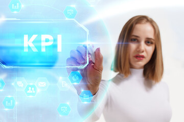 Business, Technology, Internet and network concept. Young businessman working on a virtual screen of the future and sees the inscription: KPI