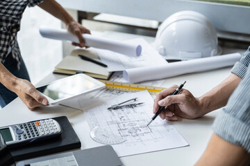 Engineer working for architectural project and tools on workplace