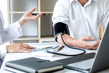 Doctor measuring examination patient and checking blood pressure
