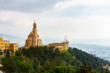 Fototapeta na wymiar Saint Paul Basilica and convent in Lebanon. Panoramic view of the Church on the Mountain on the Lebanese coast. Beautiful landscape