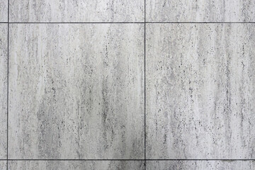 Grey tiled floor in a clean condition with grid lines for the background.