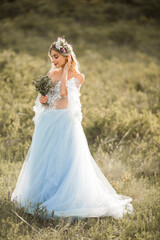 Fototapeta na wymiar beautiful young woman with makeup and hairstyle in wedding peignoir