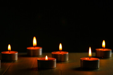 Small candles in dark background