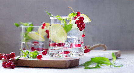 Homemade lemonade with fresh mint, lemon and red currant, summer refreshment