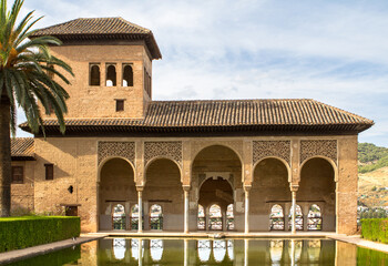 Torre de las Damas in a garden of the Alhambra in Granada, Spain
