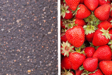 Freshly picked Strawberry in a wooden box. Sweet natural fruits in wooden crate.
