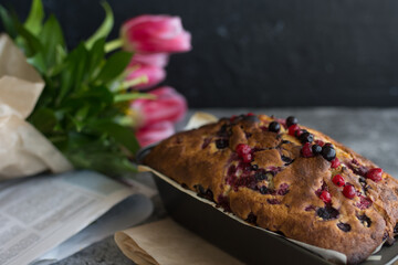 Loaf cake with red berries on the table
