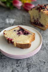 Loaf cake with red berries on the table