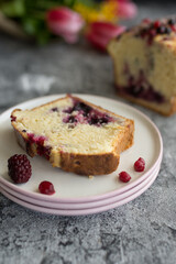 Loaf cake with red berries on the table