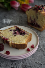 Loaf cake with red berries on the table