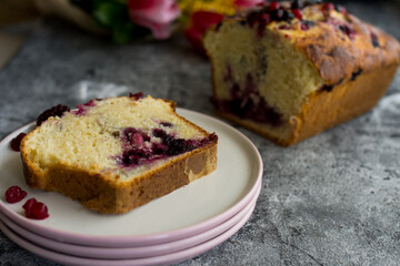 Loaf cake with red berries on the table