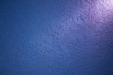 Lilac ray of light on a blue structural background with patterns