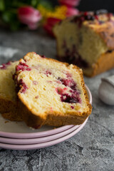 Loaf cake with red berries on the table