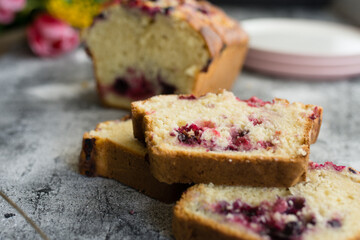 Loaf cake with red berries on the table