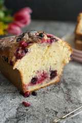 Loaf cake with red berries on the table