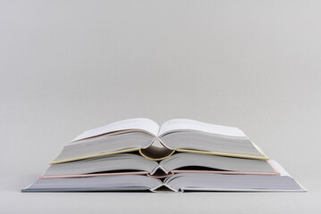 Stack of opened books education and wisdom concept