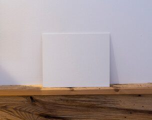 White frame on white wall background, mock up	
