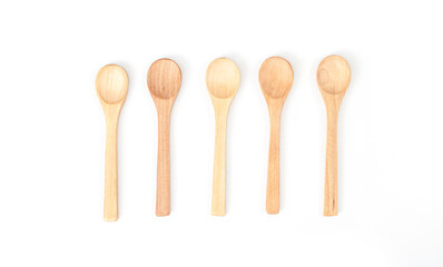 Small wooden measuring spoon isolated