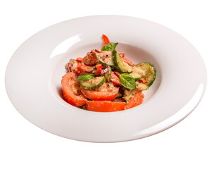 Georgian vegetable salad with peanut sauce. Isolated image on white background.