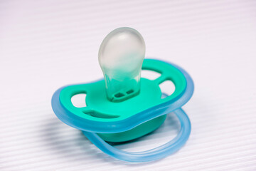 Blue pacifier on white background. pacifiers colored pacifiers