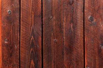 Naklejka premium Natural wooden background from boards painted in mahogany color, texture for photo design, for the production of photo backdrops, banner for an advertisement or invitation, place for text