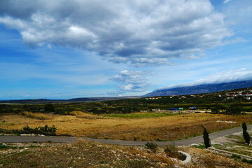 Fototapeta na wymiar View of the rural landscape in front of city of Kolan on the Croatian island of Pag