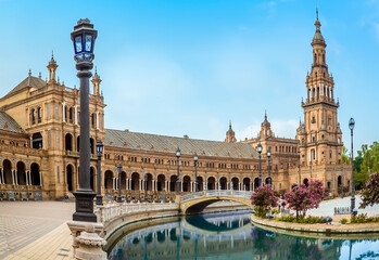 Fototapeta na wymiar A view along the southern side of the Plaza de Espana in Seville, Spain in the early morning in summertime