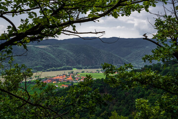 Obraz premium Vineyards And Settlement Beneath River Danube In Wachau Valley In Austria