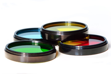 Stack of old photographic glass color filters isolated